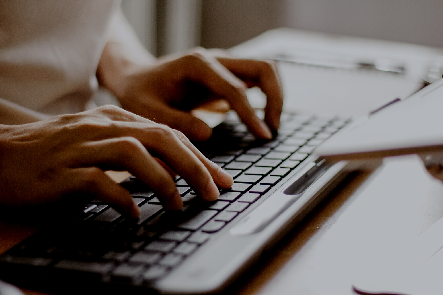Male Hands Typing on a Wireless Computer Keyboard
